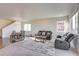 Inviting living room with ample natural light and a cozy dining area nearby at 9373 Pitkin St, Commerce City, CO 80022