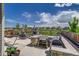 Backyard with outdoor kitchen, fireplace, seating, and artificial grass at 16578 E 111Th Pl, Commerce City, CO 80022
