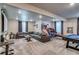 Spacious finished basement offering a large sectional sofa, a pool table, and arcade games at 16578 E 111Th Pl, Commerce City, CO 80022