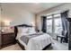 Cozy bedroom with large windows, stylish decor, and comfortable furnishings at 16578 E 111Th Pl, Commerce City, CO 80022