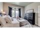 Comfortable bedroom with plenty of natural light, stylish furnishings, and pleasant decor at 16578 E 111Th Pl, Commerce City, CO 80022