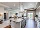 Beautiful kitchen island with granite countertops, pendant lights and stainless steel dishwasher at 16578 E 111Th Pl, Commerce City, CO 80022
