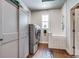 Convenient laundry room featuring modern appliances and storage at 16578 E 111Th Pl, Commerce City, CO 80022