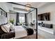Stunning main bedroom featuring tray ceiling, chandelier, and television at 16578 E 111Th Pl, Commerce City, CO 80022