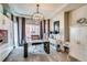 Bright home office with large windows, modern chandelier, and custom built-ins at 16578 E 111Th Pl, Commerce City, CO 80022