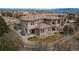 Sprawling home with a tile roof, multiple balconies, and professionally landscaped backyard at 237 Maplehurst Dr, Highlands Ranch, CO 80126