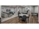 Open basement with seating area, table, and game zone with foosball at 237 Maplehurst Dr, Highlands Ranch, CO 80126