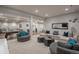 Finished basement offering open layout, ample seating, and recreational areas at 237 Maplehurst Dr, Highlands Ranch, CO 80126