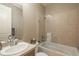 Bright bathroom with a shower and bathtub, a glass partition, and a beige-colored vanity at 237 Maplehurst Dr, Highlands Ranch, CO 80126