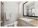 Bathroom with modern vanity, new sink, and tiled shower at 237 Maplehurst Dr, Highlands Ranch, CO 80126