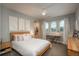 Bright bedroom with a large window, a desk, and stylish decor at 237 Maplehurst Dr, Highlands Ranch, CO 80126