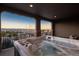 Outdoor deck with a hot tub and a view of the neighborhood below at 237 Maplehurst Dr, Highlands Ranch, CO 80126