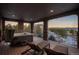 Covered deck with a hot tub, lounge chairs, and panoramic mountain views at 237 Maplehurst Dr, Highlands Ranch, CO 80126