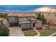Stunning home featuring a beautiful tile roof and stone accents with a mountain view at 237 Maplehurst Dr, Highlands Ranch, CO 80126
