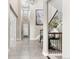 Spacious foyer featuring tile floors, high ceilings, and decorative lighting fixtures at 237 Maplehurst Dr, Highlands Ranch, CO 80126
