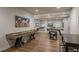 Bright game room features a shuffleboard table, foosball table, and additional seating area at 237 Maplehurst Dr, Highlands Ranch, CO 80126