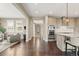 Bright kitchen featuring stainless steel appliances, shaker cabinets, and hardwood floors at 237 Maplehurst Dr, Highlands Ranch, CO 80126