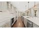 Spacious kitchen with stainless steel appliances, long island, and open design to dining area at 237 Maplehurst Dr, Highlands Ranch, CO 80126