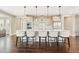 Bright, modern kitchen with large island, counter seating, and stainless steel appliances at 237 Maplehurst Dr, Highlands Ranch, CO 80126