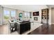Comfortable living room with fireplace, built-in shelving, and abundant natural light at 237 Maplehurst Dr, Highlands Ranch, CO 80126