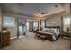 Bright bedroom with tray ceilings, many windows, ample space and stylish decor at 237 Maplehurst Dr, Highlands Ranch, CO 80126