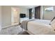 Comfortable bedroom with a connecting bathroom and white furniture at 4455 Tejon St, Denver, CO 80211