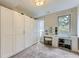 Spacious walk-in closet with custom shelving and vanity with makeup station at 4455 Tejon St, Denver, CO 80211