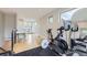 Bright home gym featuring modern exercise equipment, hardwood floors, and natural light at 4455 Tejon St, Denver, CO 80211