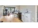 Bright home gym featuring modern exercise equipment, hardwood floors, and wet bar at 4455 Tejon St, Denver, CO 80211