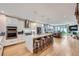 Modern kitchen with stainless steel appliances, island with seating, and open floor plan at 4455 Tejon St, Denver, CO 80211