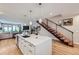Open-concept kitchen featuring a large island, modern finishes, and seamless living space at 4455 Tejon St, Denver, CO 80211