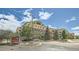 Attractive apartment complex with well-maintained landscaping and beautiful blue sky, perfect for comfortable living at 13456 Via Varra # 406, Broomfield, CO 80020