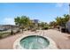 Relaxing community hot tub with outdoor seating and trees in the background, perfect for leisure at 13456 Via Varra # 406, Broomfield, CO 80020