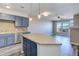 Stylish kitchen with stainless steel appliances, island with pendant lights, and natural light at 13456 Via Varra # 406, Broomfield, CO 80020