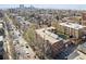 Aerial view of a brick apartment building surrounded by trees in urban neighborhood at 1410 Vine St # 3, Denver, CO 80206