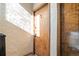 Apartment unit with secured entry shows bright natural light, textured wall, and door with unit number at 1410 Vine St # 3, Denver, CO 80206
