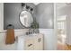 Stylish bathroom featuring modern vanity, round mirror, and decor with great lighting and plenty of space at 1410 Vine St # 3, Denver, CO 80206