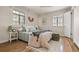Serene bedroom with hardwood floors, a cozy bed, natural light, and calming decor for a tranquil space at 1410 Vine St # 3, Denver, CO 80206