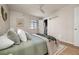 Inviting bedroom with hardwood floors, calming decor, and a bright view of a bathroom at 1410 Vine St # 3, Denver, CO 80206