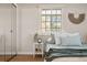 Cozy bedroom features a comfortable bed, soft pillows, and a minimalist decor, creating a peaceful retreat at 1410 Vine St # 3, Denver, CO 80206