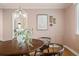 Charming dining area with a round table, modern lighting, and stylish decor, ideal for gatherings at 1410 Vine St # 3, Denver, CO 80206