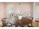 Dining room area showcases a round wooden table with four chairs, and access to the living room at 1410 Vine St # 3, Denver, CO 80206