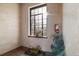 Hallway with a large window and potted plants, with an extinguisher at 1410 Vine St # 3, Denver, CO 80206