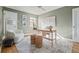 Bright home office with wood desk, cozy chair, and decorative accents at 1410 Vine St # 3, Denver, CO 80206
