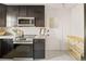 Modern kitchen with sleek appliances, granite countertops, and stylish backsplash, offering a functional cooking space at 1410 Vine St # 3, Denver, CO 80206