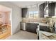 Functional kitchen with stainless steel appliances, granite countertops, and tile flooring, blending style with practicality at 1410 Vine St # 3, Denver, CO 80206