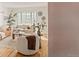 Bright living room featuring a large window, a comfortable sofa, and stylish decor at 1410 Vine St # 3, Denver, CO 80206