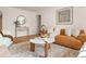 Charming living room featuring hardwood floors, stylish furniture, and tasteful decor, creating a cozy atmosphere at 1410 Vine St # 3, Denver, CO 80206
