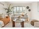 Bright living room with large window, comfortable seating, and stylish decor providing a cozy and inviting atmosphere at 1410 Vine St # 3, Denver, CO 80206