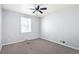 Bedroom features carpet, neutral paint, ceiling fan and natural light at 2718 S Hazel Ct, Denver, CO 80236
